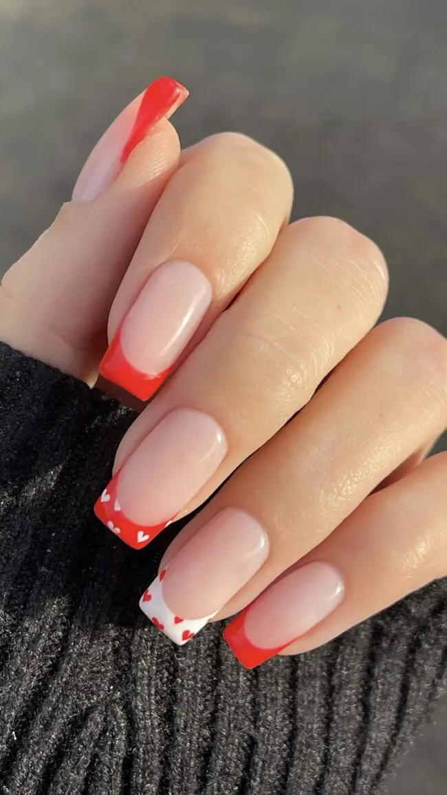 Bold Red Nails with Heart Embellishments