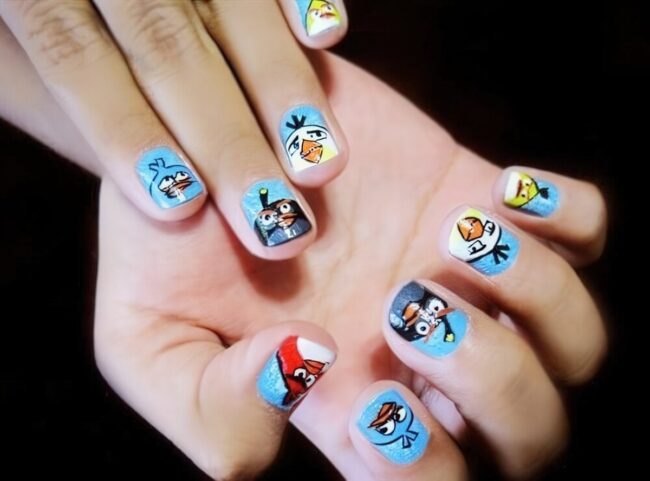 Whimsical Cartoon Nails with Bright Blue