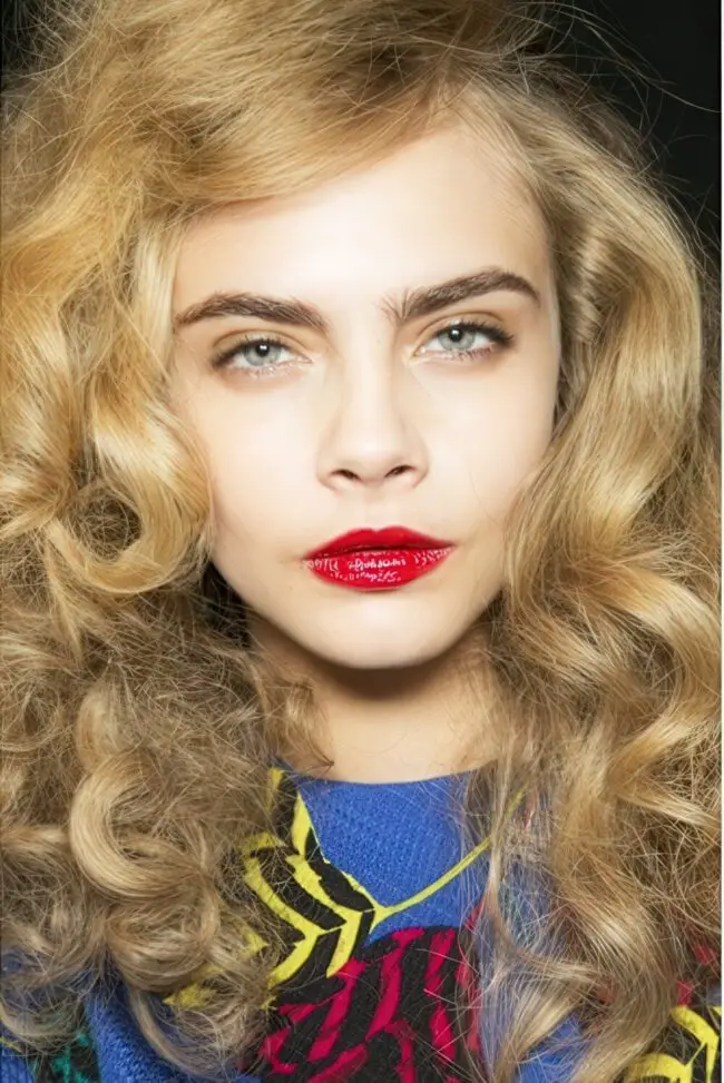Striking Red Lips with Whimsical Curls
