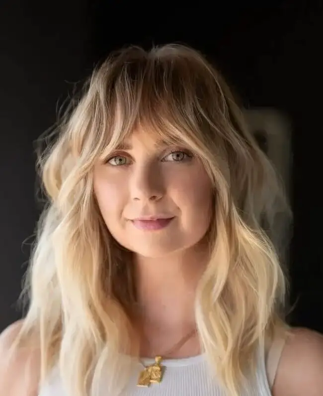 Sun-Kissed Wavy Layers with Bardot Bang
