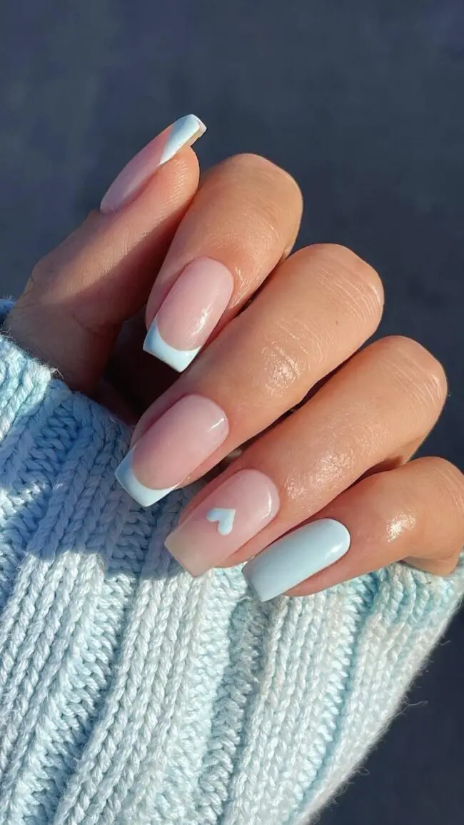 Classic French Manicure with Soft Blue Hues