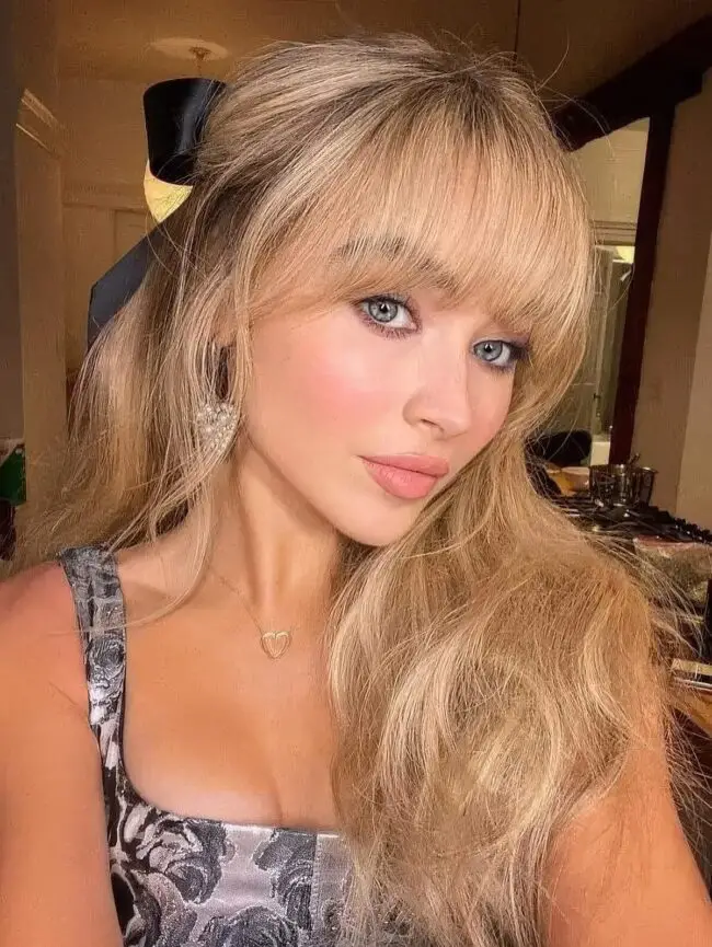 Luminous Blonde Waves with Playful Fringe