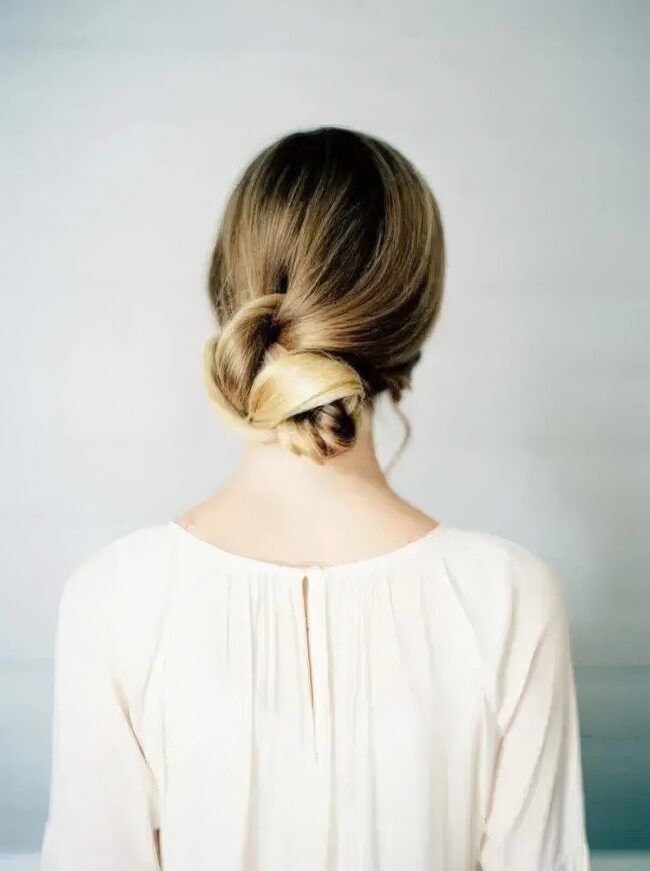 Low Bun with Soft Tendrils