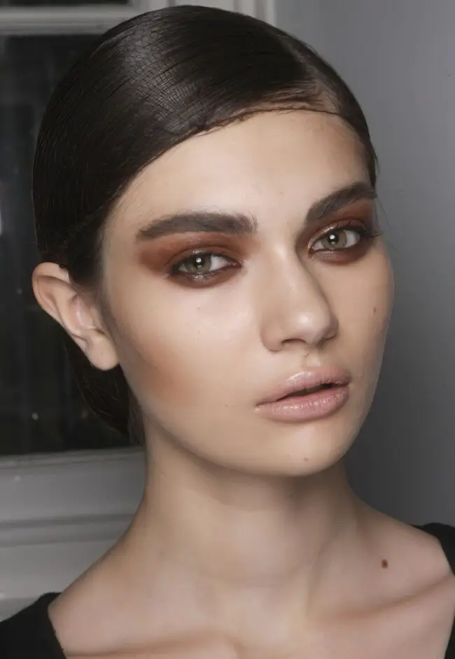 Glossy Low Bun with Warm Highlights