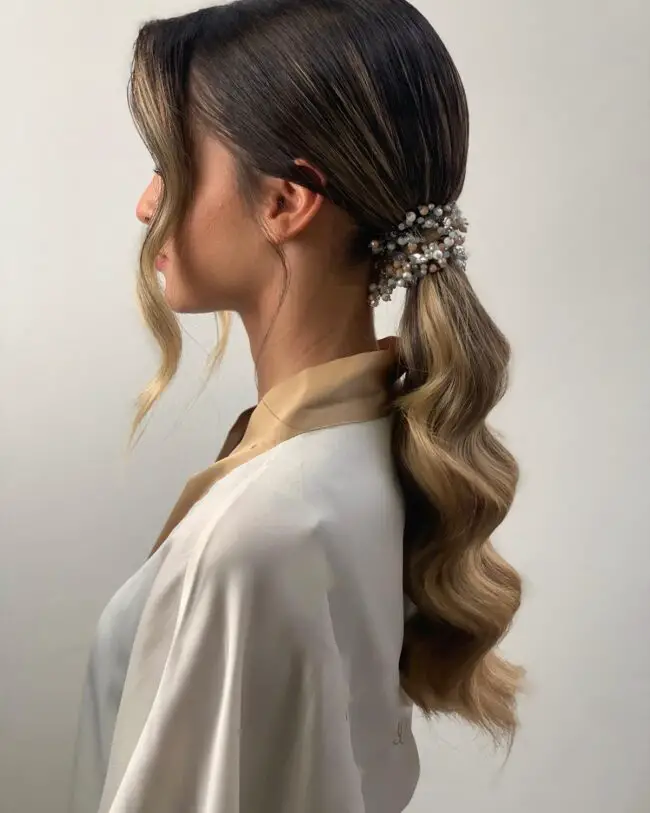 Sleek Low Ponytail with Decorative Hairpiece