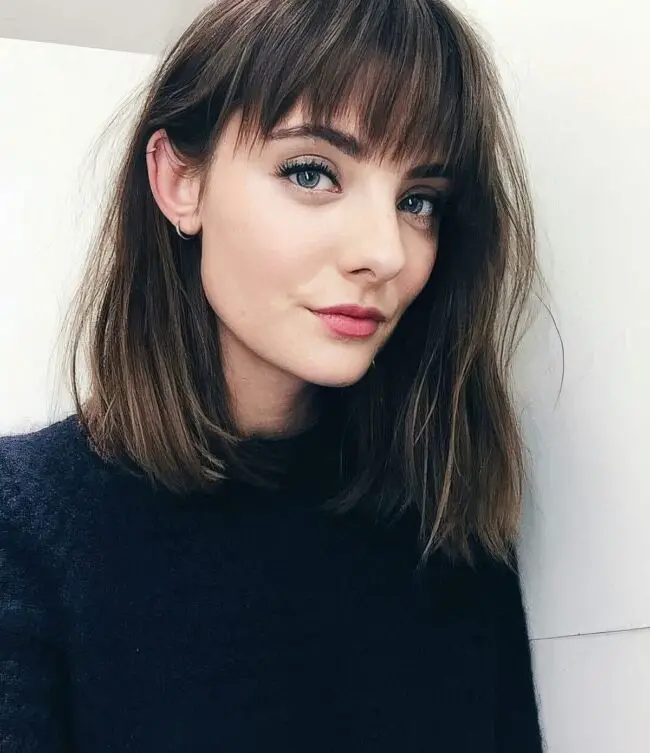 Fringe Bangs with Warm Highlights Unveiled