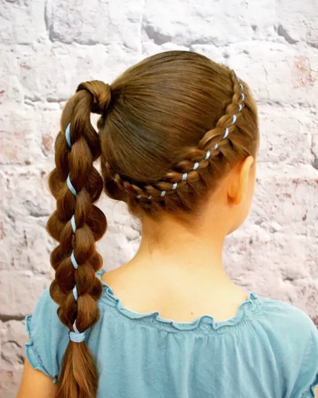 Braided Crown Adorned with a Blue Ribbon