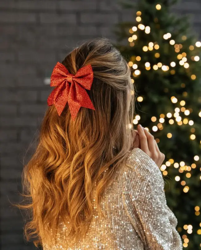 Half-Up Hairstyle with Glittering Red Bow
