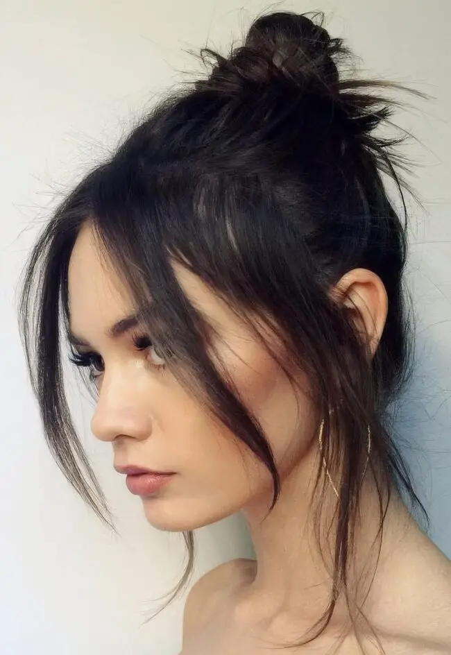 Messy Bun with Face-Framing Strands