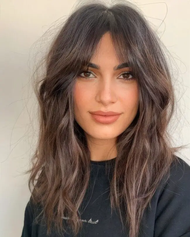 Rich Brunette Waves with Edgy Bangs