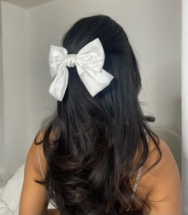 Sleek Half-Updo with Bow Accessories