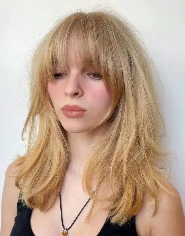 Sun-Kissed Blonde Waves with Bangs